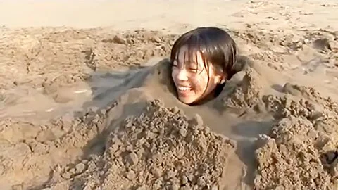 Girl Buried In Beach
